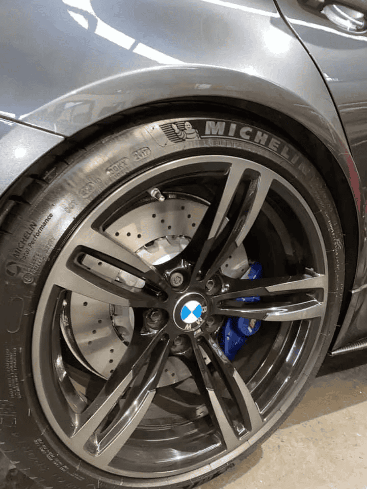 High-performance BMW wheel featuring Michelin tire and advanced braking system.